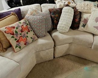 WRAP AROUND COUCH WITH LOTS OF PILLOWS FOR SALE