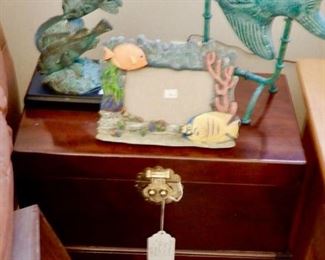NICE LITTLE CHEST WITH FISH DECORATIVE PIECES.