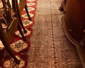 Very large oriental rug with bad damage at right corner and some detachment at one end, but remarkably  otherwise very little wear! 