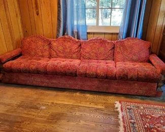 Front view of beautiful 9' long vintage couch.