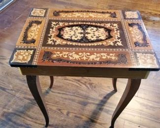 Inlaid wood small English game table.