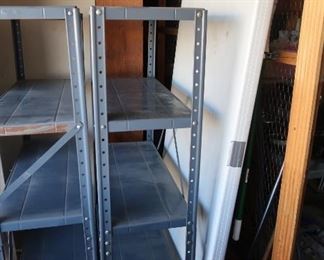 2 tables and 4 metal shelving units