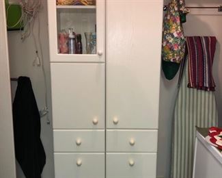 Storage cabinet with built in pull out hamper....