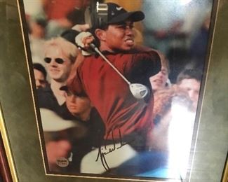  Includes signature attributed to  Tiger Woods with COA