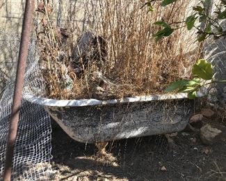 Antique cast iron bathtub (full of dirt)