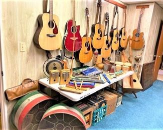 Many Acoustic Guitars and Musical Instruments including a Mini Harp