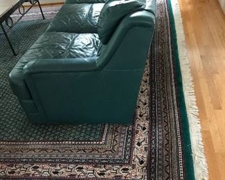 Pr of Green leathe couches from Toms Price and a beautiful like new Kaleen wool area rug