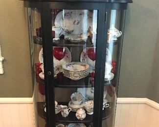 Victorian Claw-foot Curved-Glass Curio Cabinet. This piece’s petite size makes it easy to add to an existing room to hold those cherished heirlooms.
