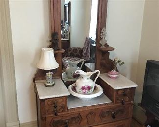 Marble top Victorian Dreaser as part of a 3-piece suite.