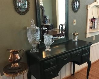 High in quality and dainty in design, this Thomasville Sideboard and Mirror ensemble looks classy In the dining room.