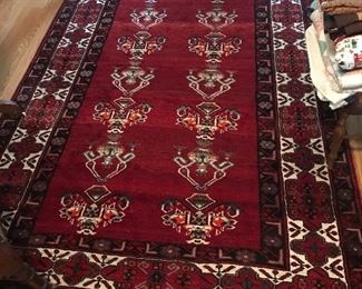 Vibrantly colored, this hand-tied area rug is perfect for a hallway or accent piece.