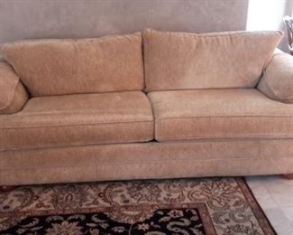 Light brown/tan Bassett sofa, nice and clean.