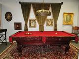 American made custom slate top Gandy 8.5 Pool table, Victorian frames and prints. Oriental rug. Designer window dressing complete with all accessories. Antique slag glass & bronze chandelier.