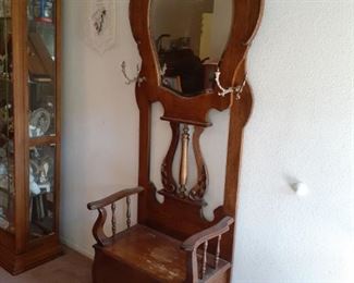 Oak hall tree with carving and beveled mirror