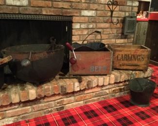 Huge cauldron . Vintage American Beer and Carlings crates.