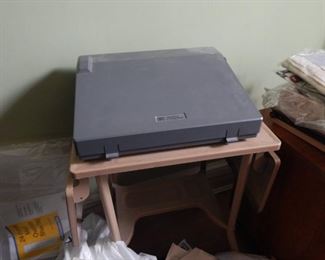 Typewriter/ table on wheels.