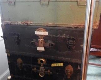 Stack of vintage storage travel trunks.