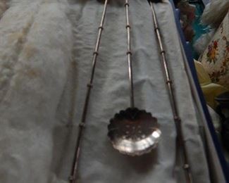 Silver serving tea spoons.