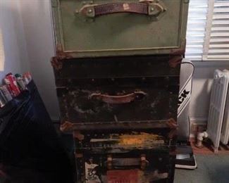 Several vintage trunks.