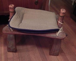 From her many travels. Nice stool from another land. We have two of these stools.