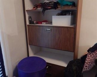 One of two open cabinet furnishings.