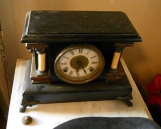 Rare vintage desk or mantel clock with marble and wood accents. Gold leaf frame around clock face.