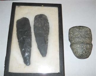 Historical Indian carved spears and stone artifacts