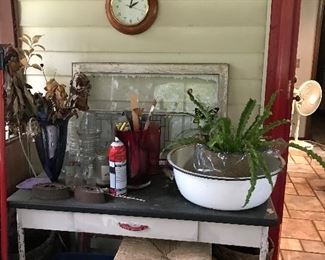 Potting table * wicker and wood stool * old windows * plants