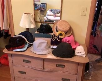 Chest of drawers/small dresser; selection of vintage hats.