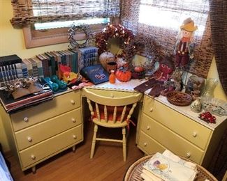 Vintage sectional desk with chair; Halloween- and autumn-themed decor; many books.