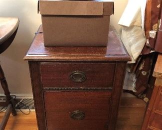 Compact side table with drawers.