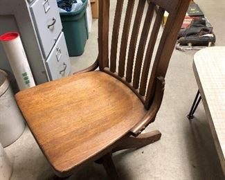 Antique wood swivel chair.