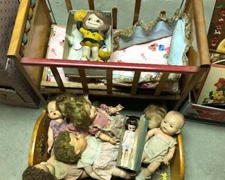 Vintage dolls, crib and cradle.