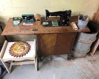 Singer sewing machine with cabinet.