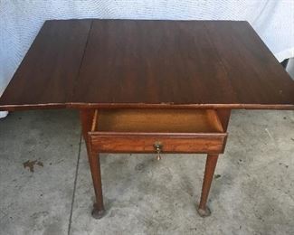 End table with fold out wings.