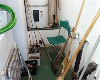 1 st Floor Garage:  Fishing Poles & Reels, Broom, Mops,l