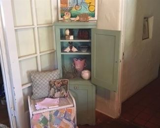 Original whimsical bicycle painting, vintage painted cupboard, white wicker hamper, vintage handstitched quilt, and some awesome accessories!