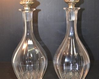 PAIR OF CRYSTAL DECANTERS WITH STERLING STOPPERS