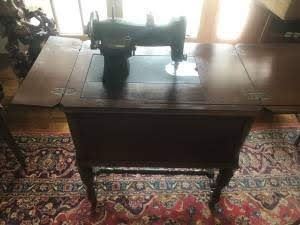 Vintage White rotary sewing machine in cabinet.  Circa 1927