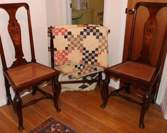 Inlaid chairs and antique quilts