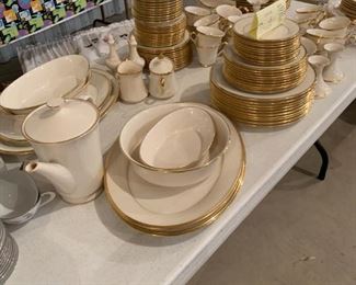 2 sets of Lenox gold-rimmed china. Each set has 10  5-pc. place settings plus serving pieces