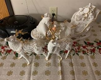white porcelain with gold trim Santa, reindeer and sleigh