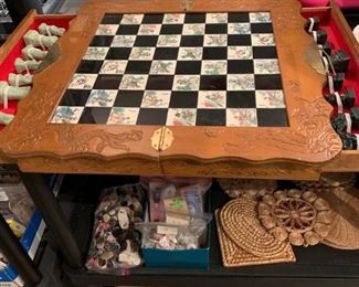 Same chess board showing drawew holding chess pieces