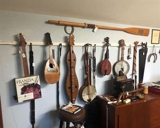 Lots of musical instruments. Banjo's, Dulcimer, Wine box banjo, other instruments.
