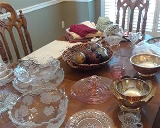 Lots of sculpted  glass and silverplated serving pieces for yhe holidays
