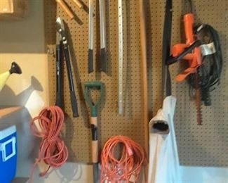 More yard tools including hedge trimmers, rakes, and more