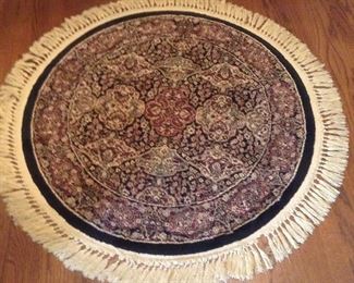 Small round red, black, beige area rug 45".