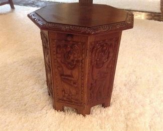 Two carved wood side tables.