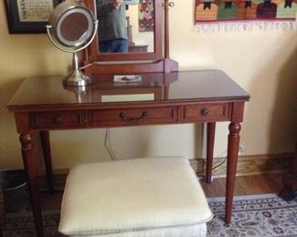 Make-up table with three drawers and mirror.
