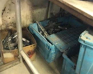 Boxes and bins of vintage hood ornaments and emblems